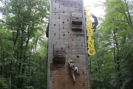 Student climbing climbing wall
