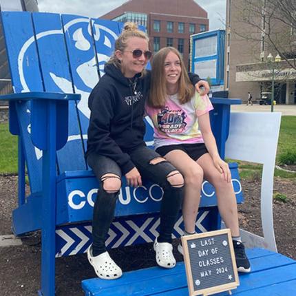 Students sitting on big blue chair