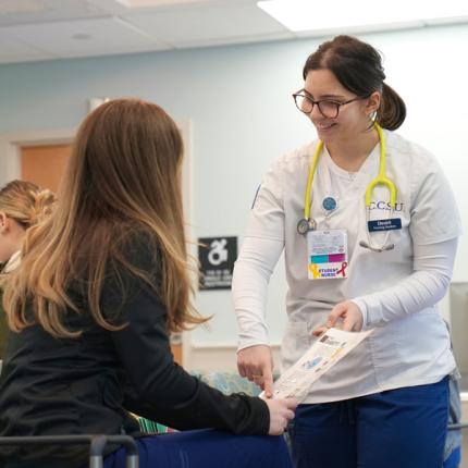 Student working in clinic with child