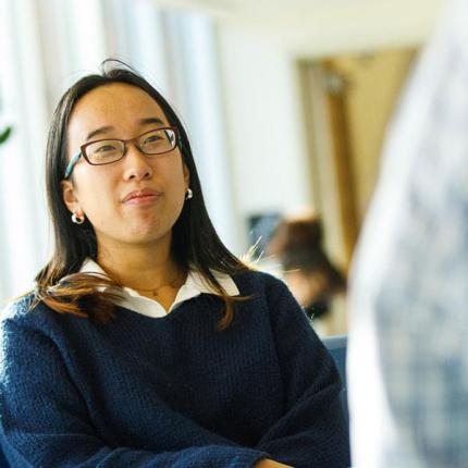 Student in workplace speaking to supervisor