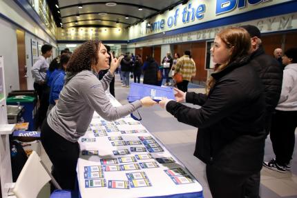 A prospective student checks in at the spring Accepted Students Day at Central.