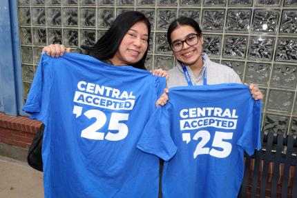 Attendees at Accepted Students Day show off their custom T-shirts.