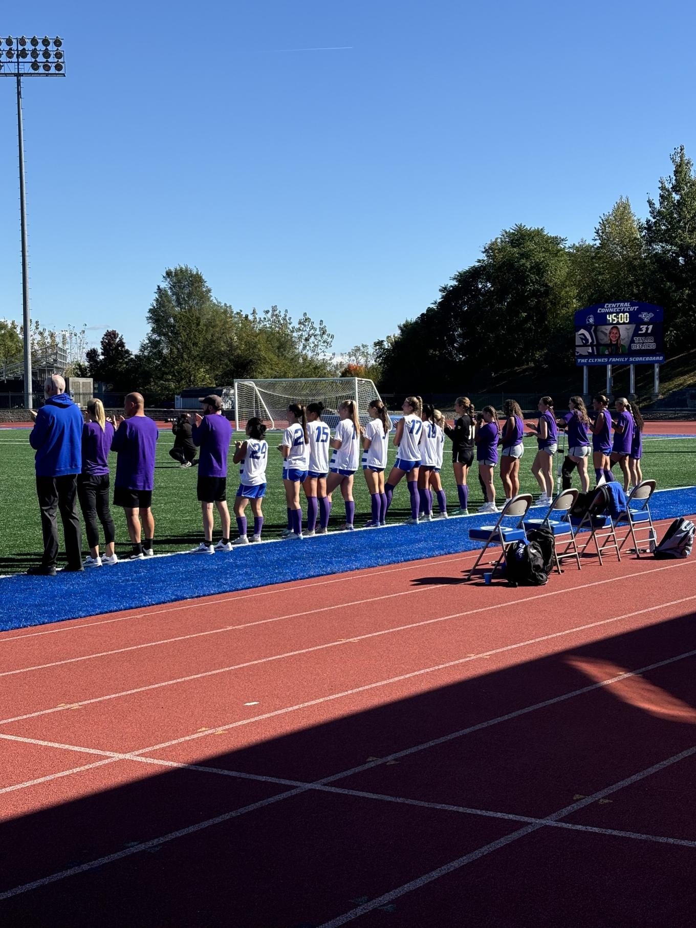 Central athletes wearing purple