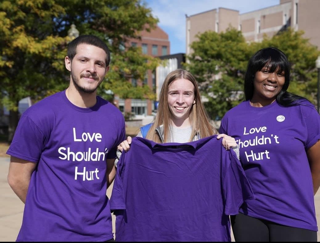 Group Wearing "Love Shouldn't Hurt" shirts.png