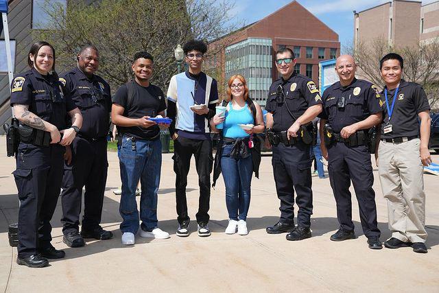 Police outside the student center with students holding ice cream