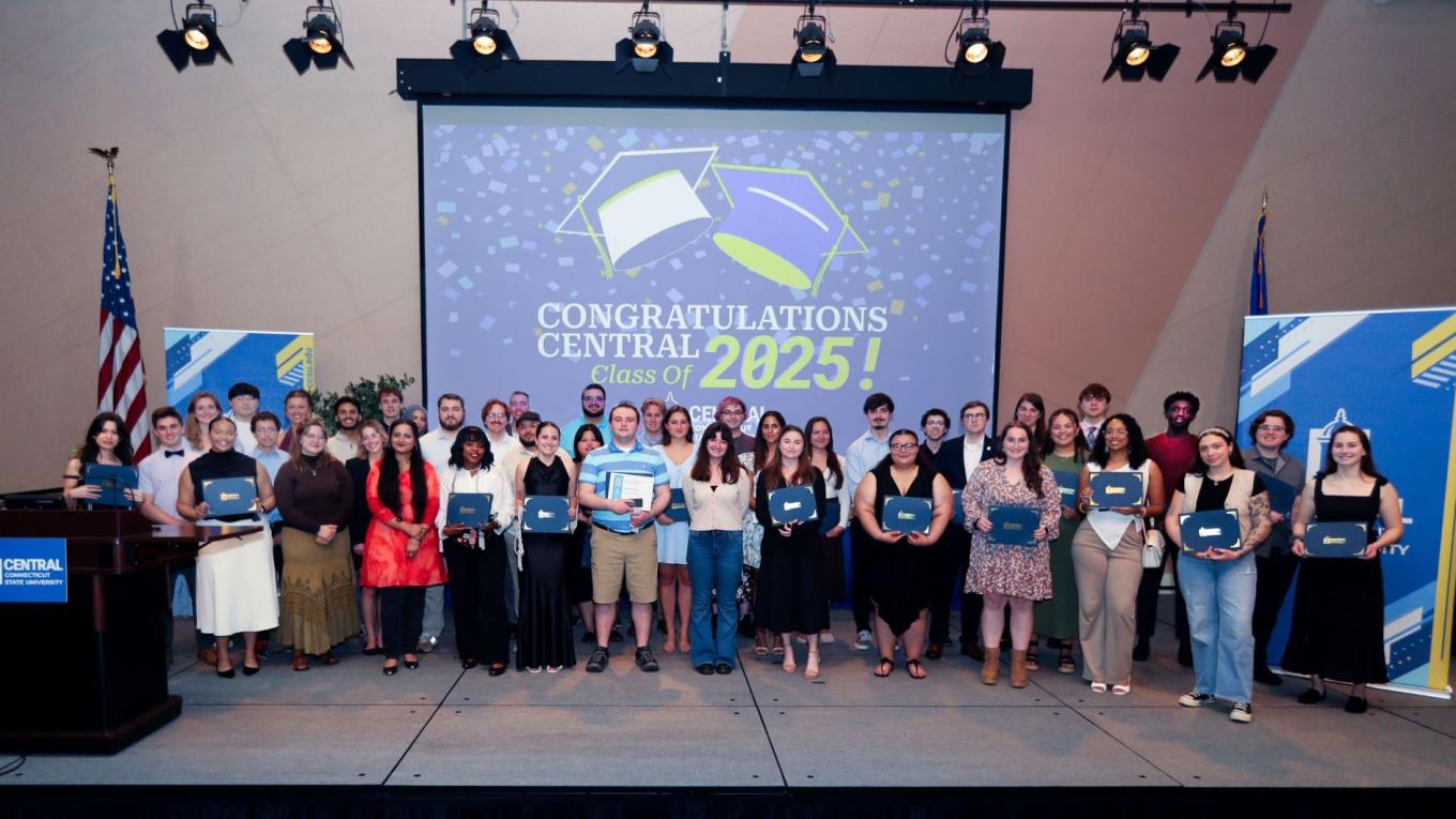Winners of the 2025 academic awards for outstanding scholarship and leadership on stage at Alumni Hall.
