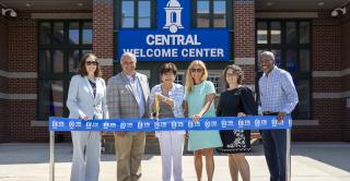 Central Welcome Center ribbon-cutting group photo