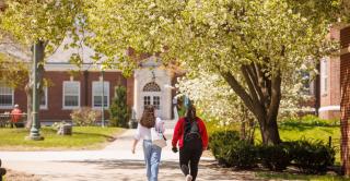 Students walk on sidewalk at Central.